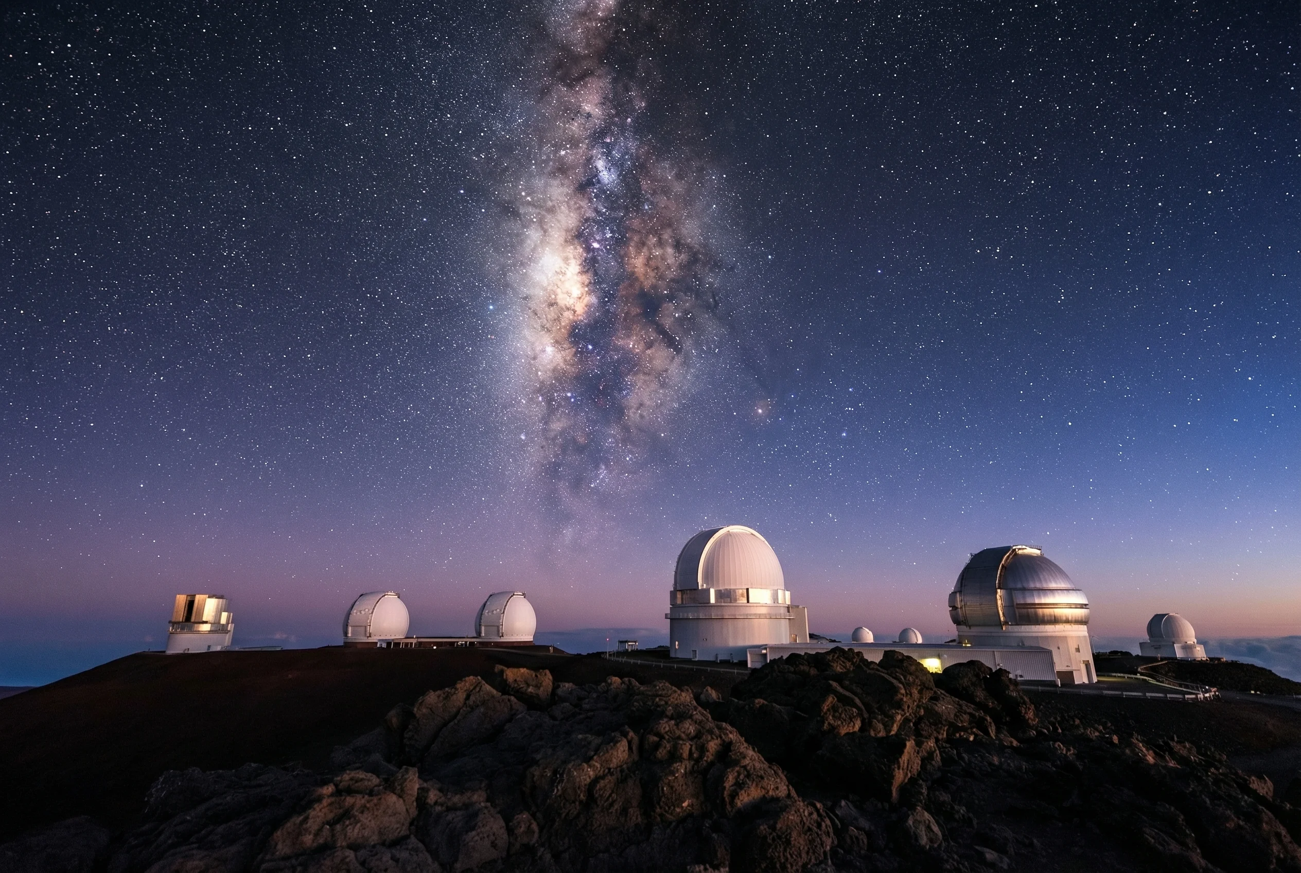 Mauna Kea's 13 world-class observatories make it Earth's premier astronomy destination Mauna Kea summit stargazing with Milky Way and observatories